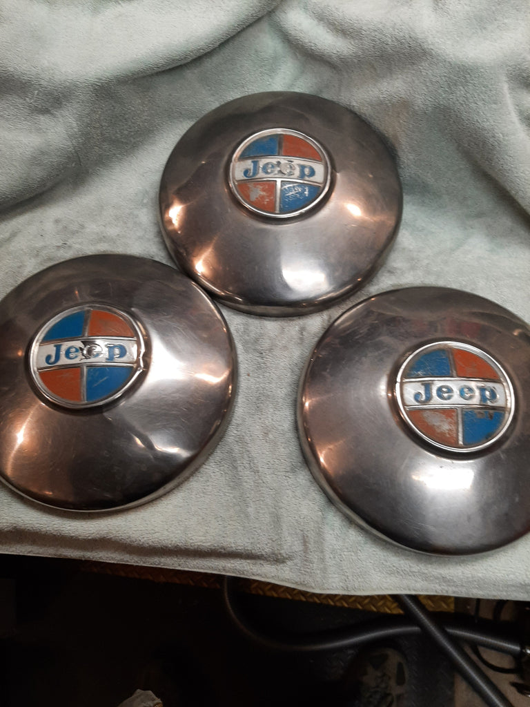 Jeep hubcaps lot of three, 1960's original, stainless caps as shown.